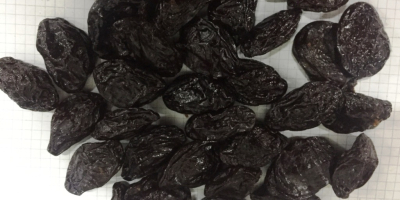 We have dried un-pitted prunes in stock for sale.